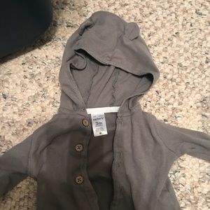 Dark gray jacket with ears on hood.